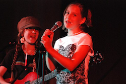 Two of the campers at a Girls Rock Camp Showcase