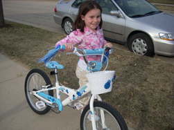 Elizabeth with her new bike from the Village Pedaler in Madison, it's her 10th b-day present - photo by Rokker