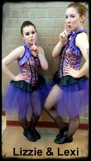 Lizzie and Lexi strinking the Angel's pose during recital break - photo by Rökker