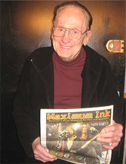 Les Paul holding a copy of Maximum Ink at 92 years old - photo by Sarah Grant